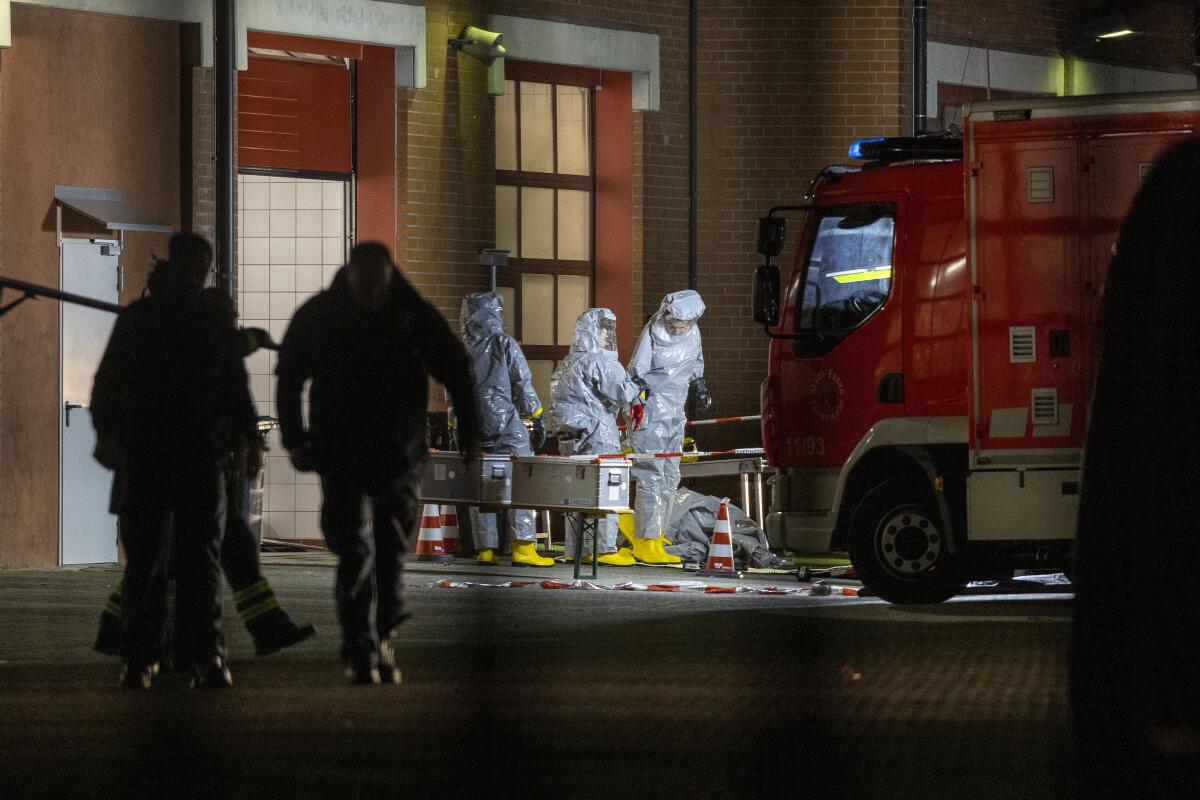 Workers in hazmat suits at a German fire department