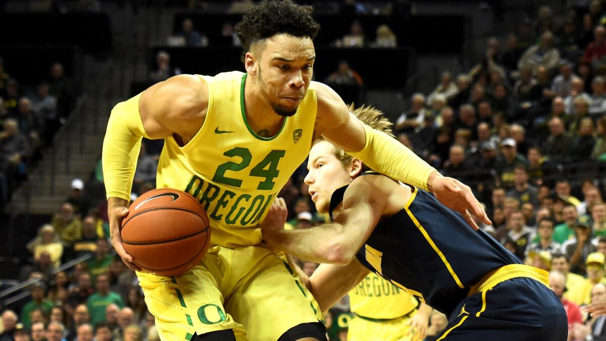 Oregon guard Dillon Brooks drives to the basket against California guard Grant Mullins during the first half Thursday.