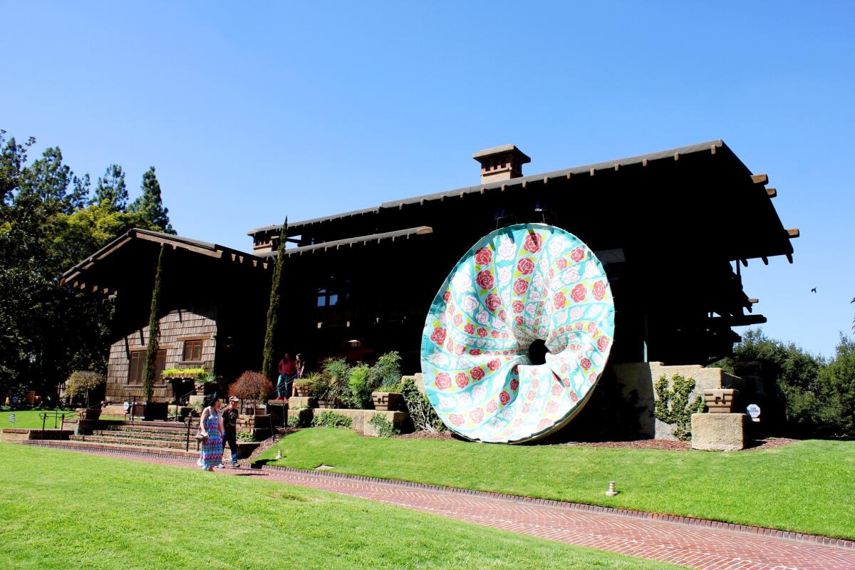 Machine Project, the arts organization based in Echo Park, has installed a series of contemporary art pieces around Pasadena's historic Gamble House as part of the AxS festival. Patrick Ballard's vortex sculpture appears to pierce the front facade.