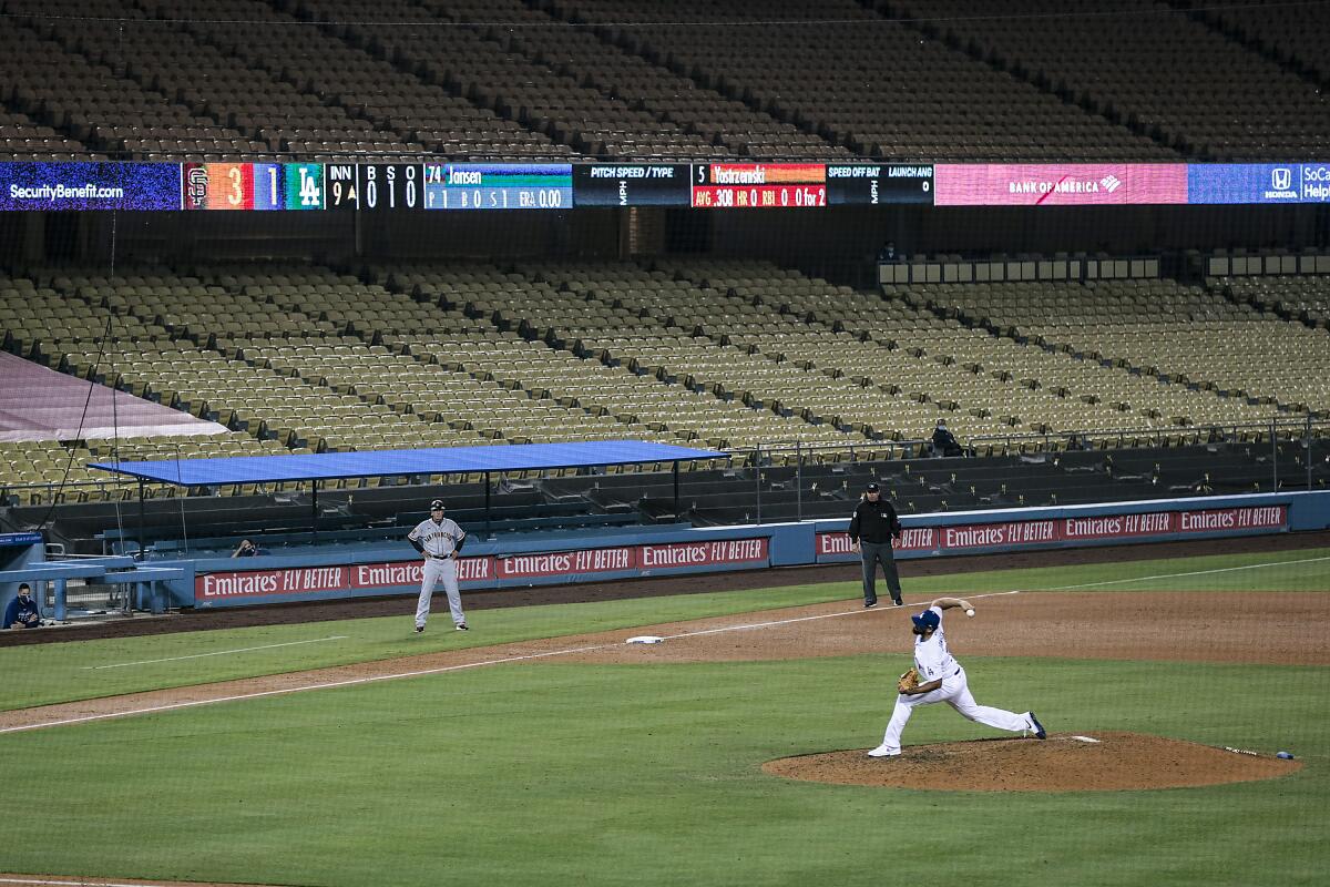Dodgers closer Kenley Jansen delivers a pitch against the San Francisco Giants at Dodger Stadium on July 26.