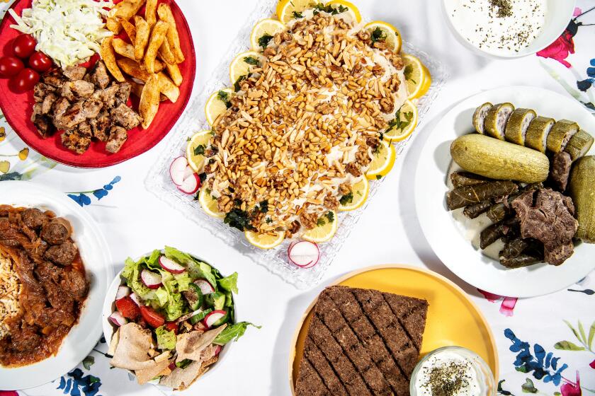 LOS ANGELES , CA - AUGUST 30: clockwise from you left: Chicken Tawook, Samke Harra, Koussa w Wara2, Kebbe bil Sayniyeh, and Dawood Basha from Mama Lina Cooks in Hollywood on Monday, Aug. 30, 2021 in Los Angeles , CA.(Mariah Tauger / Los Angeles Times)