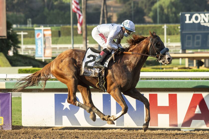 Improbable, with Drayden Van Dyke aboard, races in the Grade 1 Awesome Again Stakes at Santa Anita on Sept. 26, 2020.