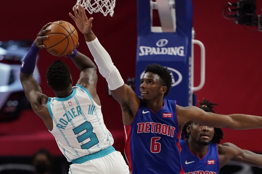 Charlotte Hornets guard Terry Rozier (3) shoots over the defense of Detroit Pistons guard Hamidou Diallo (6) during the second half of an NBA basketball game, Tuesday, May 4, 2021, in Detroit. (AP Photo/Carlos Osorio)