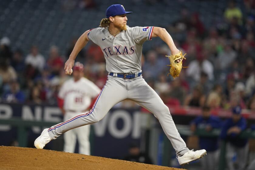 Texas Rangers starting pitcher Jon Gray throws to the mound during the first inning of a baseball game against the Los Angeles Angels, Monday, Sept. 25, 2023, in Anaheim, Calif. (AP Photo/Ryan S. Sun)