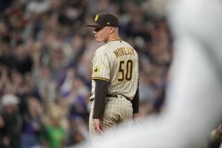 San Diego Padres relief pitcher Adrian Morejon reacts after giving up a walkoff RBI-single to Colorado Rockies' Alan Trejo in the 10th inning of a baseball game Friday, Sept. 23, 2022, in Denver. (AP Photo/David Zalubowski)