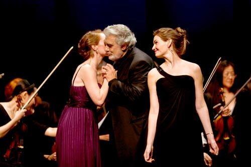 Placido Domingo, ever busy, led eight singers from Los Angeles Opera's Domingo-Thornton Young Artists Program in an opera-zarzuela concert at the Broad Stage Thursday night. Mezzo-soprano Erica Brookhyser kisses Domingo while soprano Valerie Vinzant looks on.