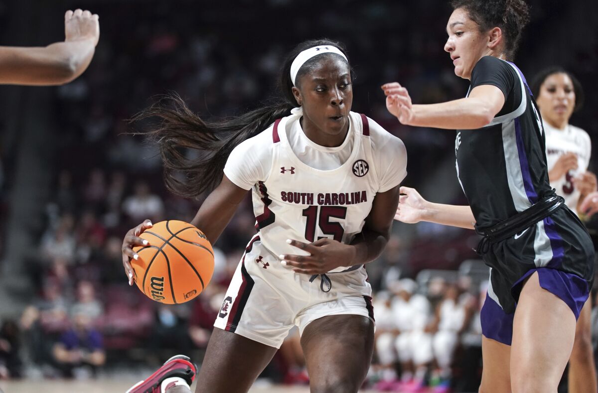South Carolina forward Laeticia Amihere (15) dribbles the ball as Kansas State guard Jaelyn Glenn defends during the first half of an NCAA college basketball game Friday, Dec. 3, 2021, in Columbia, S.C. (AP Photo/Sean Rayford)