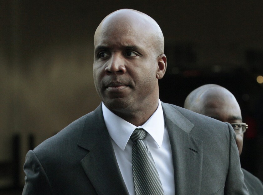 Former baseball player Barry Bonds arrives for his trial at federal court in San Francisco in March 2011. The Department of Justice said Tuesday that the reversal of Bonds' conviction for obstruction of justice would stand.