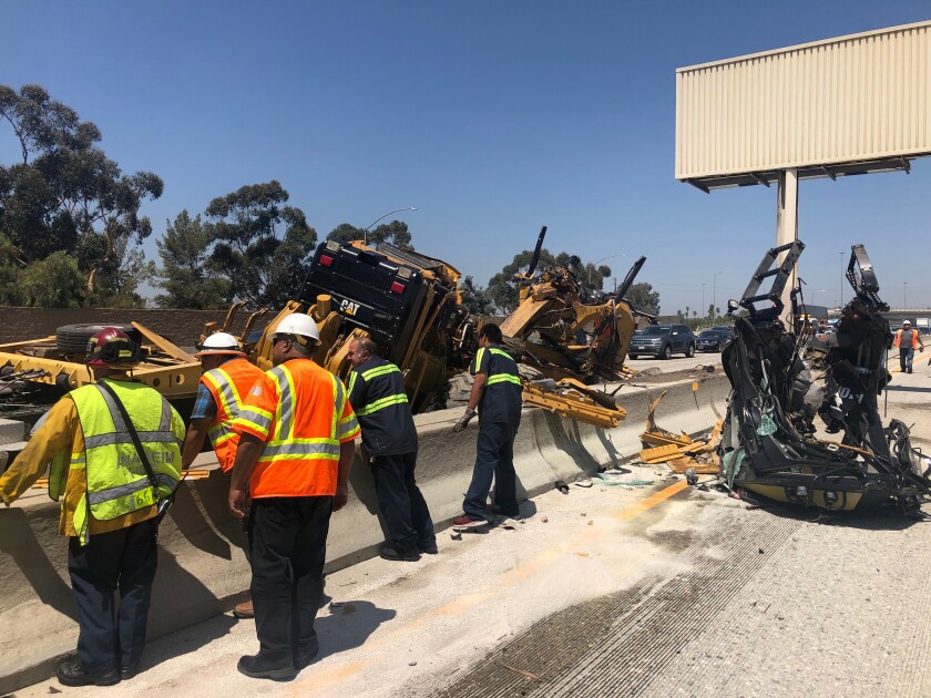 Northbound 57 Freeway shut after semitruck accident sends motor grader