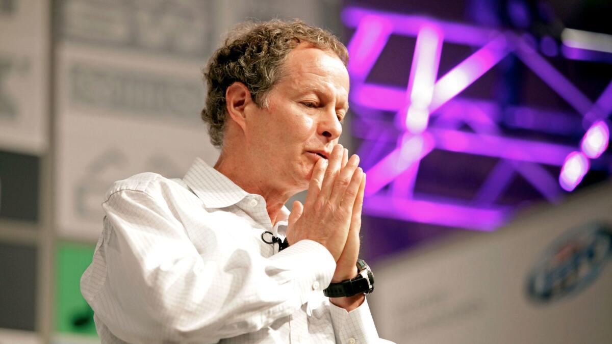 Soon to be a cog in Amazon's machine? John Mackey, co-founder and co-CEO of Whole Foods Market, seen here at a 2013 public appearance.