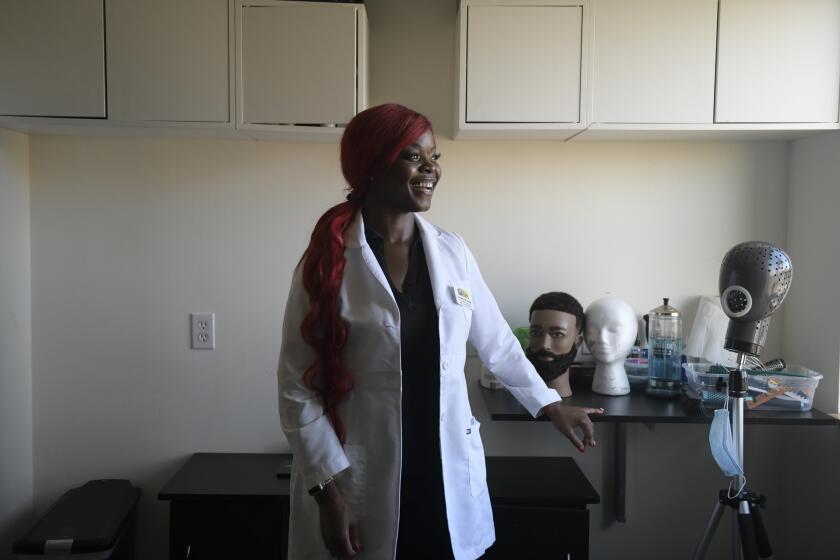 OCTOBER 12, 2021-PROVIDENCE, RI- Small business owner, Christine Paige was discovered by Kamala Harris, a round table practitioner of the first order. Portrait of Christina Paige at Bliss Hair Replacement Center. Photo by Faith Ninivaggi for The LA Times