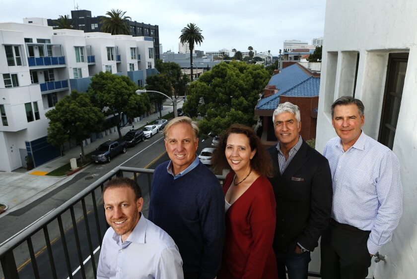 From left, March Capital Partners investors Gregory Milken and Jim Armstrong, the firm's Chief Financial Officer, Dana Moraly, and investors Sumant Mandal and Jamie Montgomery at their headquarters in Santa Monica.
