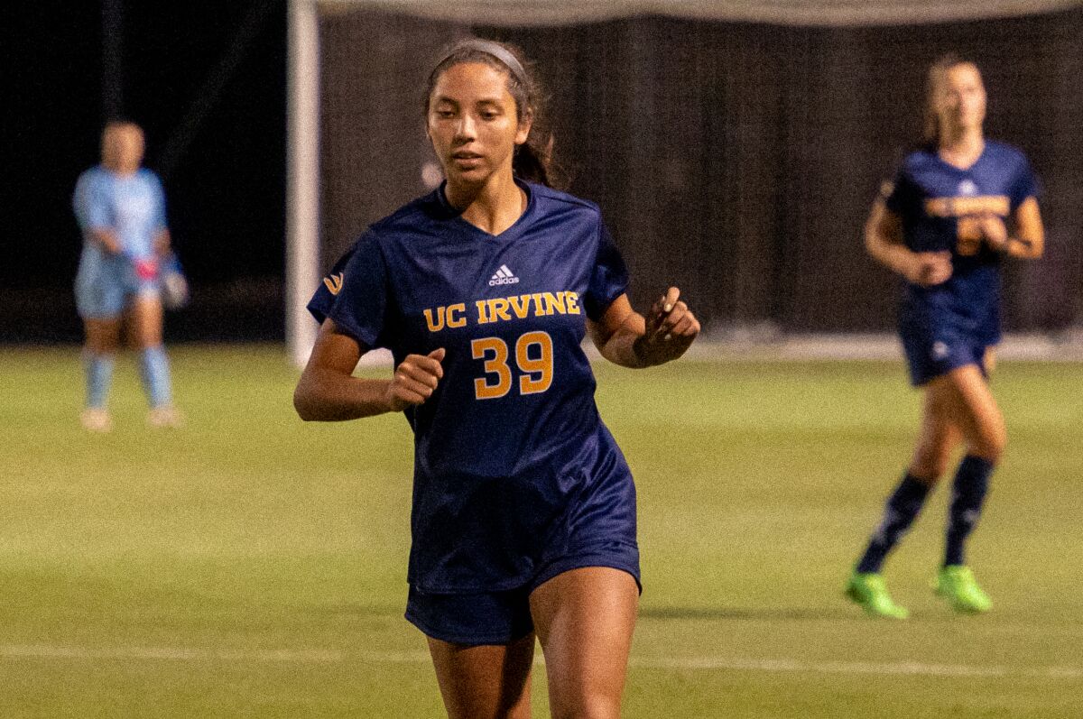 UC Irvine midfielder/forward Jenika Davis runs on the field