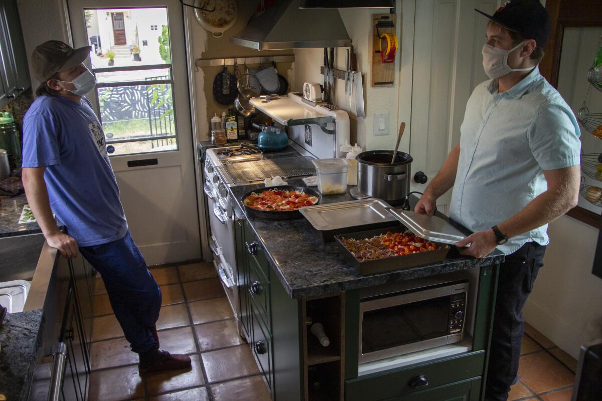 TnT Pizza's Kevin Gist, left, and Joseph Wehrly in the kitchen. 