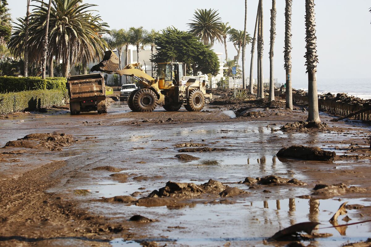 Cleanup begins Thursday morning outside the Four Seasons Biltmore on Channel Drive in Montecito.