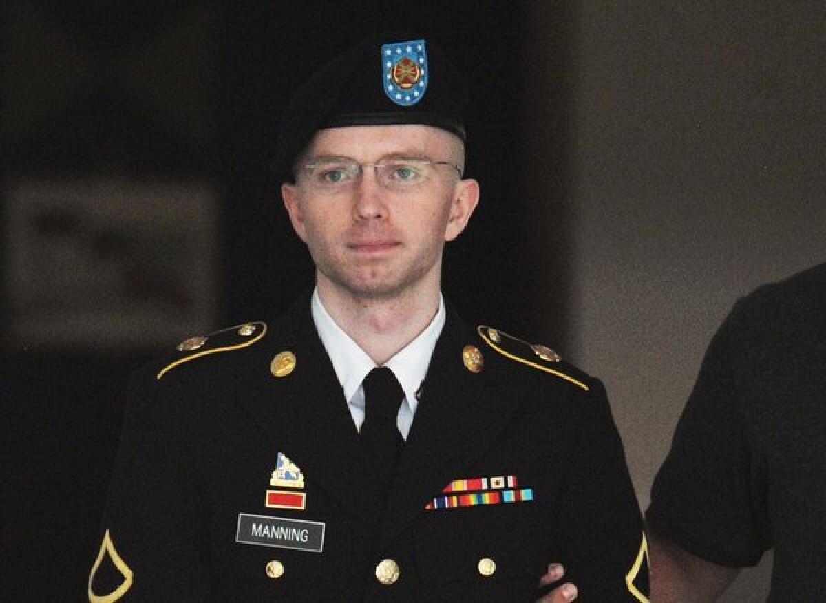 Army Pfc. Bradley Manning is escorted from court in Fort Meade, Md.