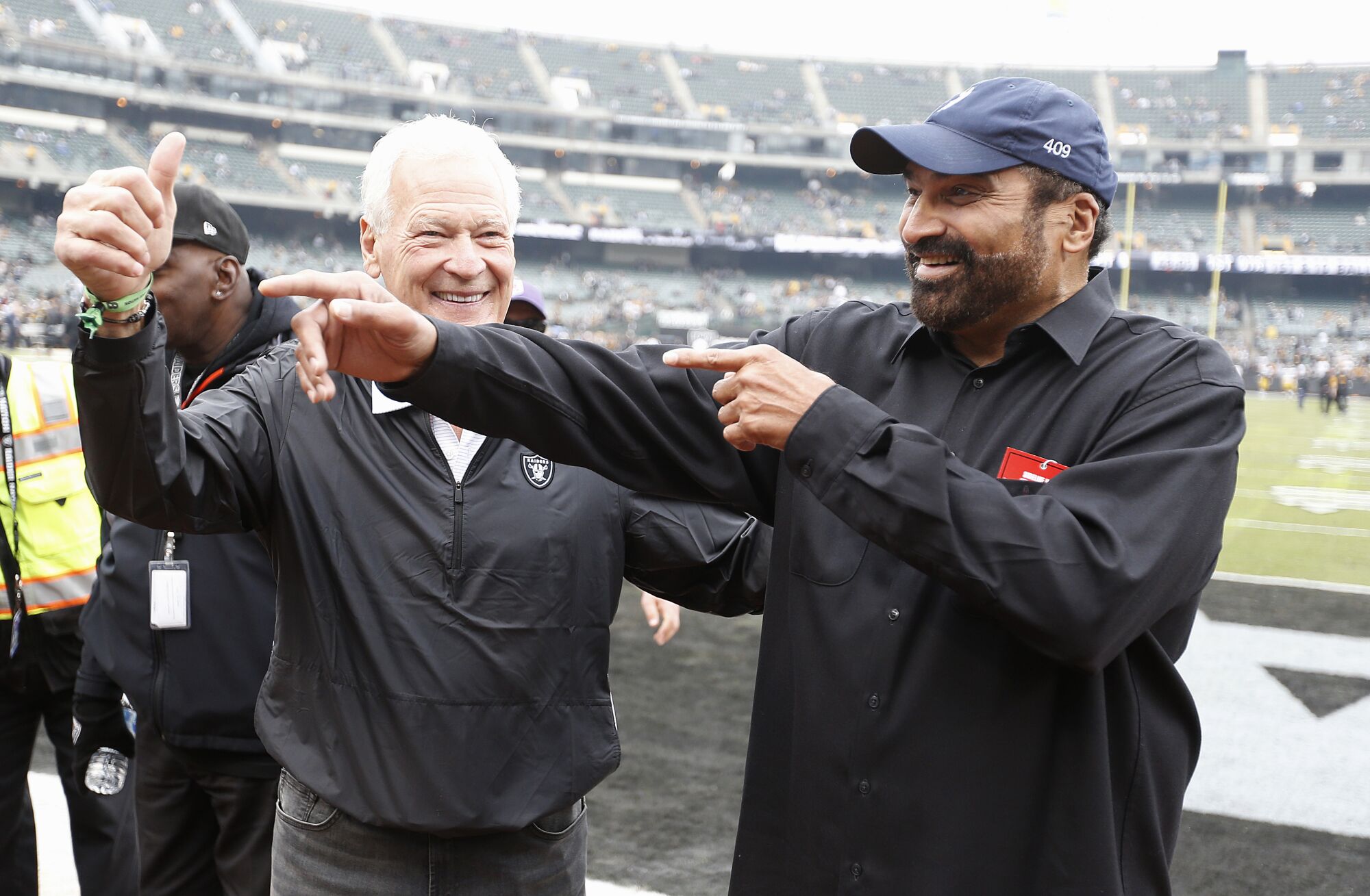 Former Oakland Raiders linebacker Phil Villapiano (left) and with former Pittsburgh Steelers running back Franco Harris.