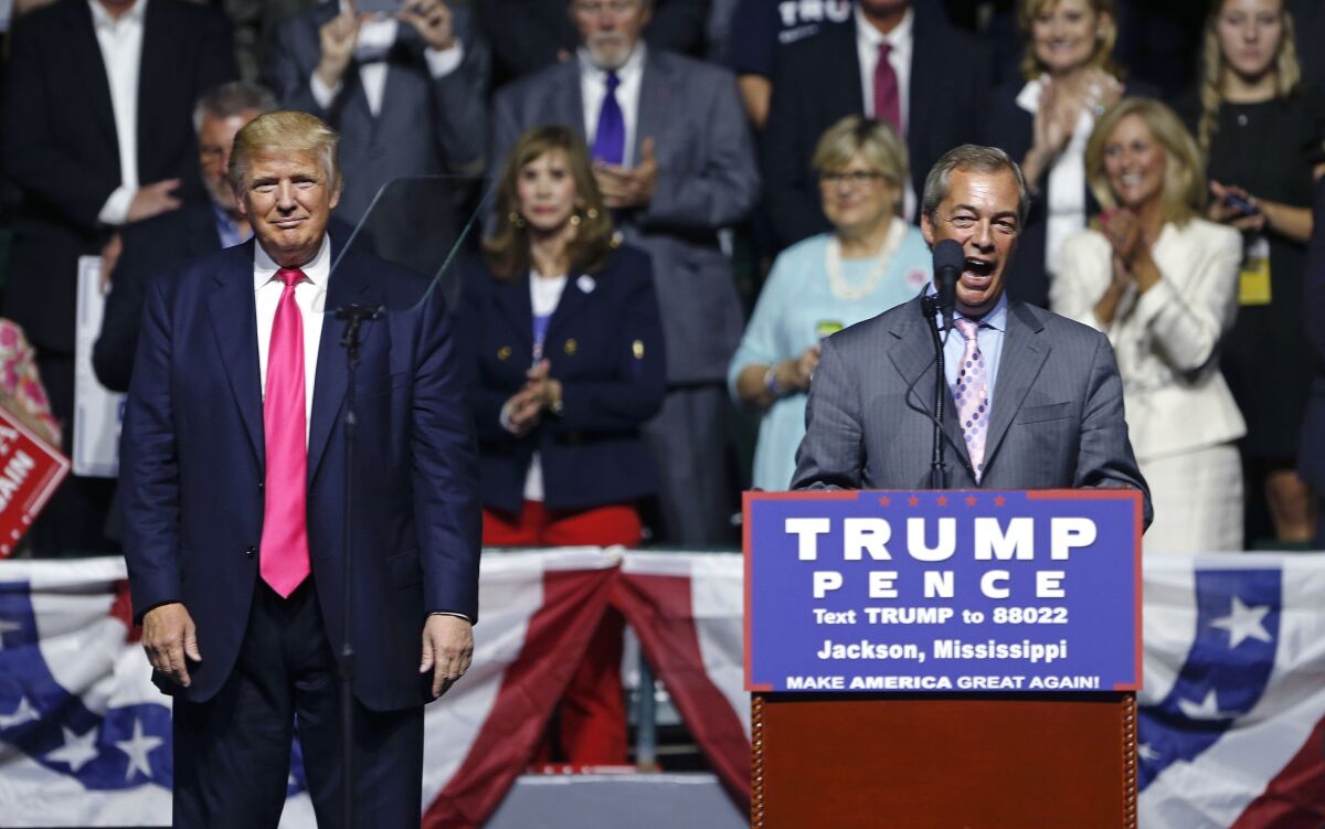 Nigel Farage speaks at a 2016 event for Donald Trump, who stands by smiling in a long pink tie.