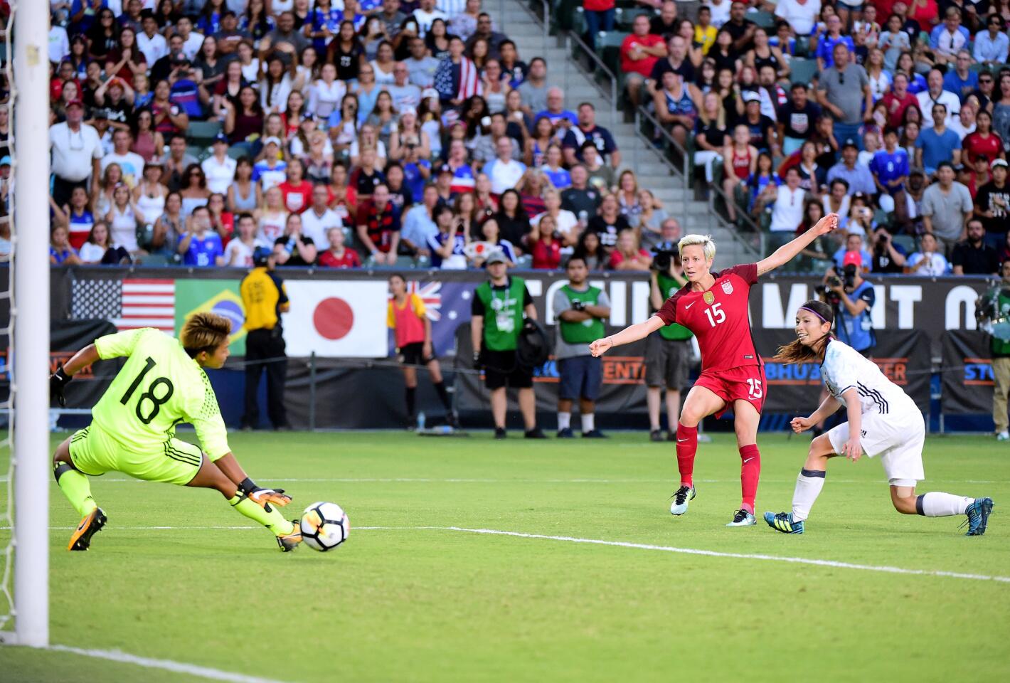 CARSON, CA - AUGUST 03: Megan Rapinoe #15 of the United States scores on Ayaka Yamashita #18 of Japan, for a 1-0 lead, as Rumi Utsugi #6 looks on during the first half during the 2017 Tournament Of Nations at StubHub Center on August 3, 2017 in Carson, California. (Photo by Harry How/Getty Images) ** OUTS - ELSENT, FPG, CM - OUTS * NM, PH, VA if sourced by CT, LA or MoD **