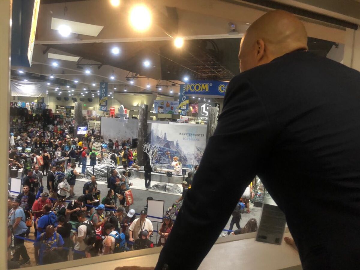 Sen. Cory Booker looks out over the exhibit hall at Comic-Con in San Diego on Friday.
