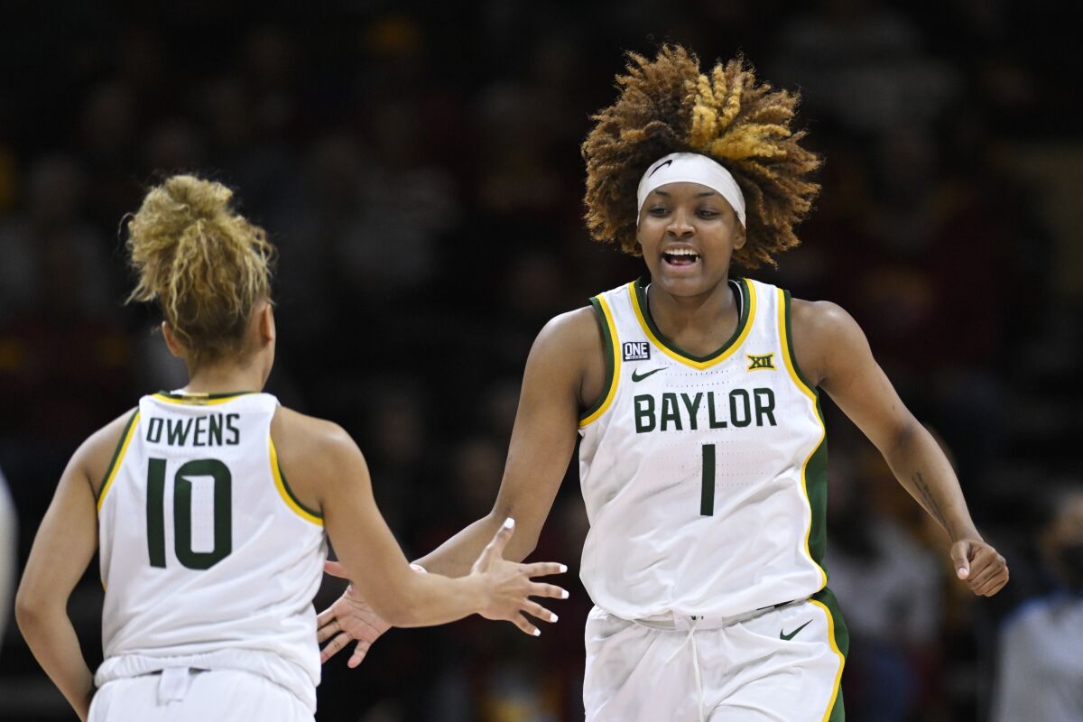 Baylor forward NaLyssa Smith (1) celebrates a play with teammate Jaden Owens (10) during the second half of an NCAA college basketball game against Oklahoma in the semifinal round of the Big 12 Conference tournament in Kansas City, Mo., Saturday, March 12, 2022. (AP Photo/Reed Hoffmann)