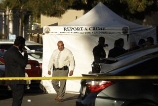WEST HILLS, CA - APRIL 1, 2023 - Police investigate the scene of a shooting in a West Hills shopping parking lot that left one person dead, inside the tent, and many others wounded at 6751 Fallbrook Avenue in West Hills on April 1, 2023. (Genaro Molina / Los Angeles Times)