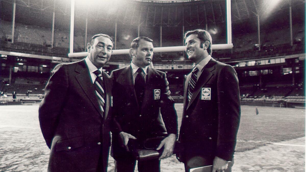 He was the voice of college football, but also noted as the inaugural play-by-play announcer on "Monday Night Football, in 1970, with Howard Cosell, left, and Don Meredith, right.