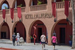 FILE PHOTO: Tourists walk past Hotel California in the town of Todos Santos, Baja California Sur, Mexico, May 2, 2017.