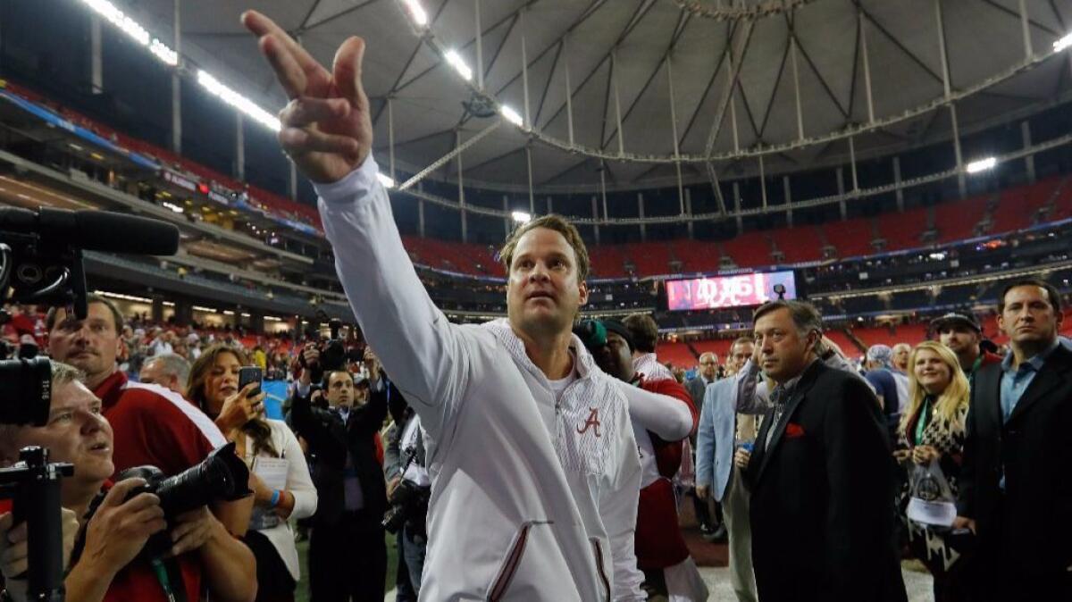 Alabama offensive coordinator Lane Kiffin celebrates after the Crimson Tide's 54-16 win over Florida in the SEC Championship game on Dec. 2.