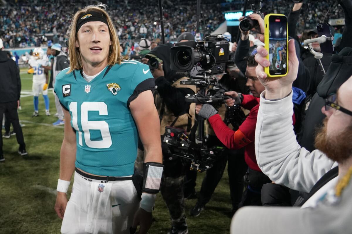 Jacksonville Jaguars quarterback Trevor Lawrence walks off the field after a 31-30 comeback win over the Chargers.