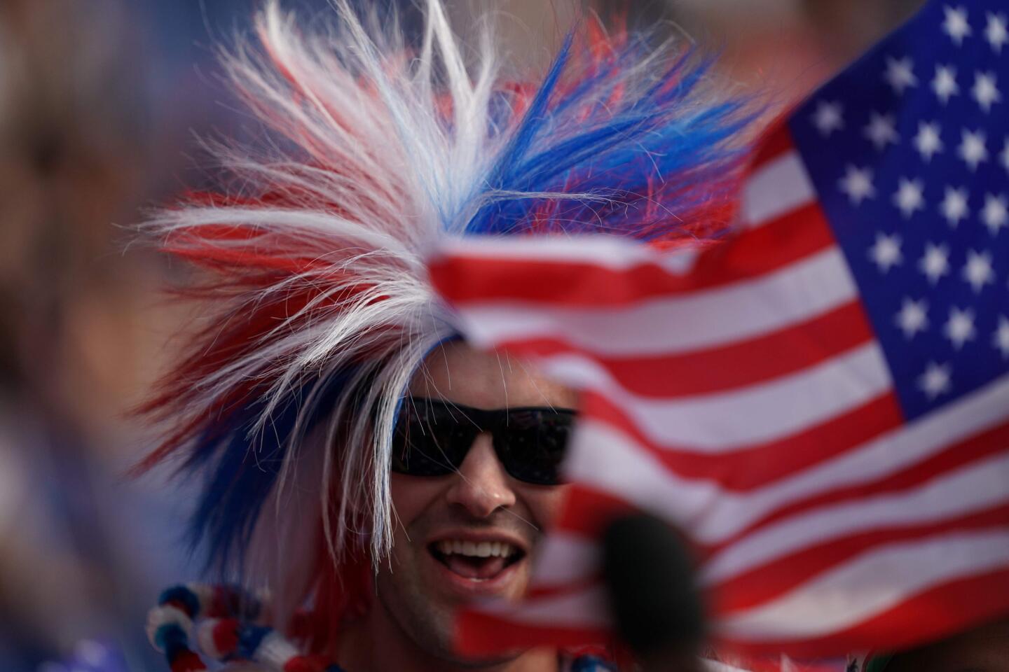 A French supporter is seen behind a U.S. flag before the United States' Women's World Cup quarterfinal against France in Paris on June 28.