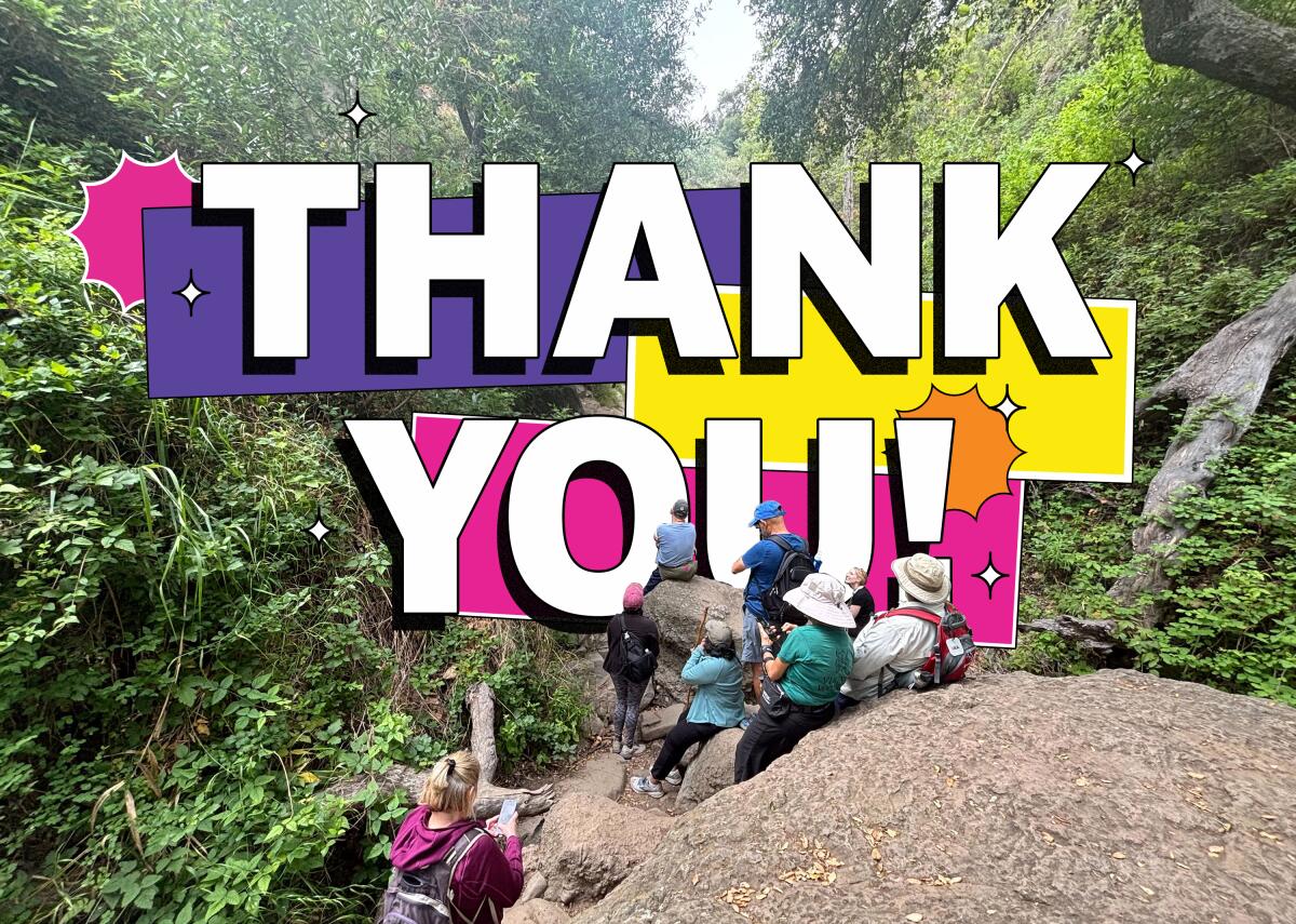 A group of people sit and stand around a narrow rocky canyon. The text reads, "Thank You!"