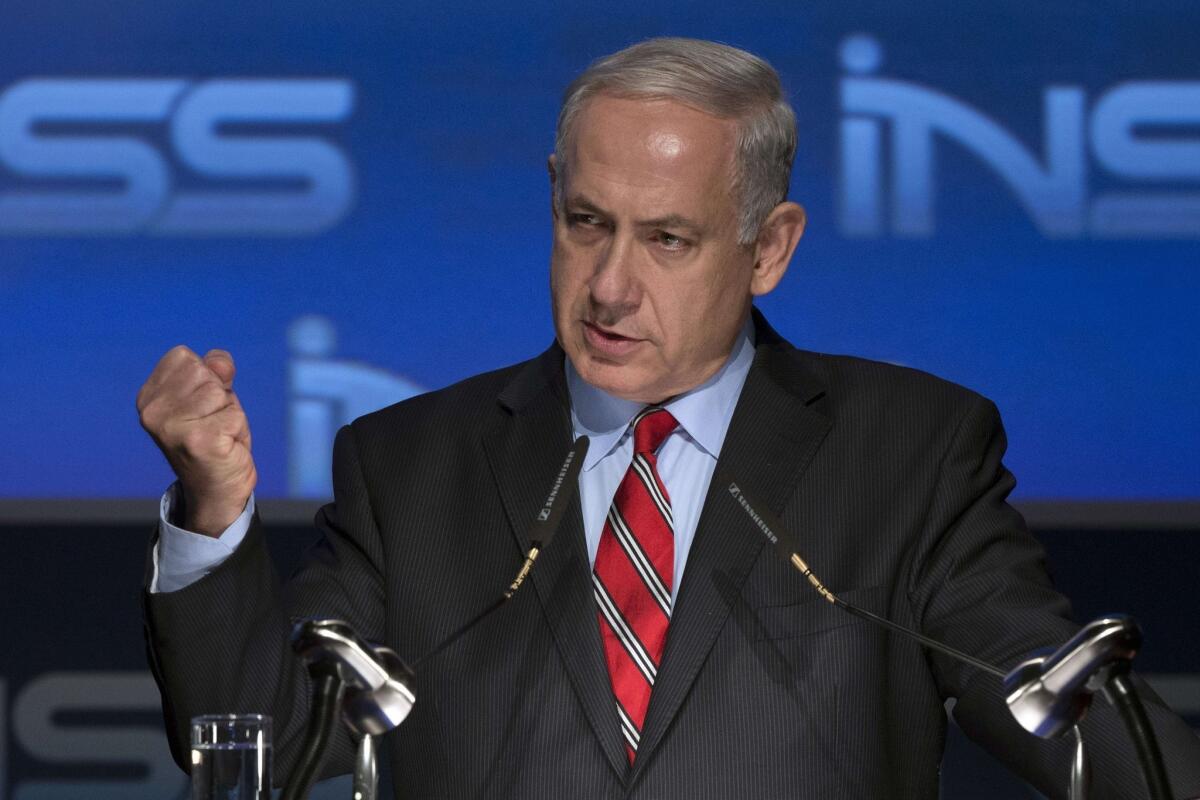 Israeli Prime Minister Benjamin Netanyahu gives a speech at the Institute for National Security Studies' conference in Tel Aviv.