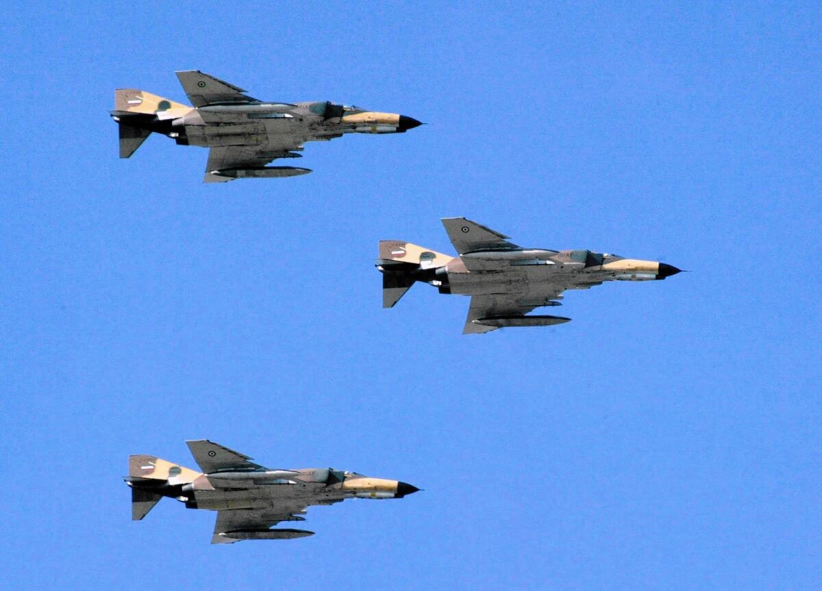 F-4 Phantom jets take part in a flyover in Tehran, which recently deployed similar jets in airstrikes against Islamic State militants in Iraq.