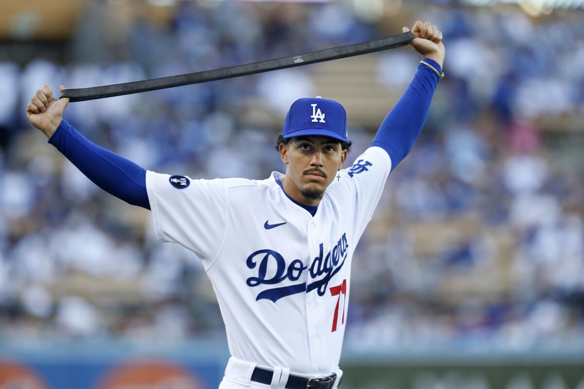 The Dodgers' Miguel Vargas stretches before a game against the Padres on Aug. 5, 2022.