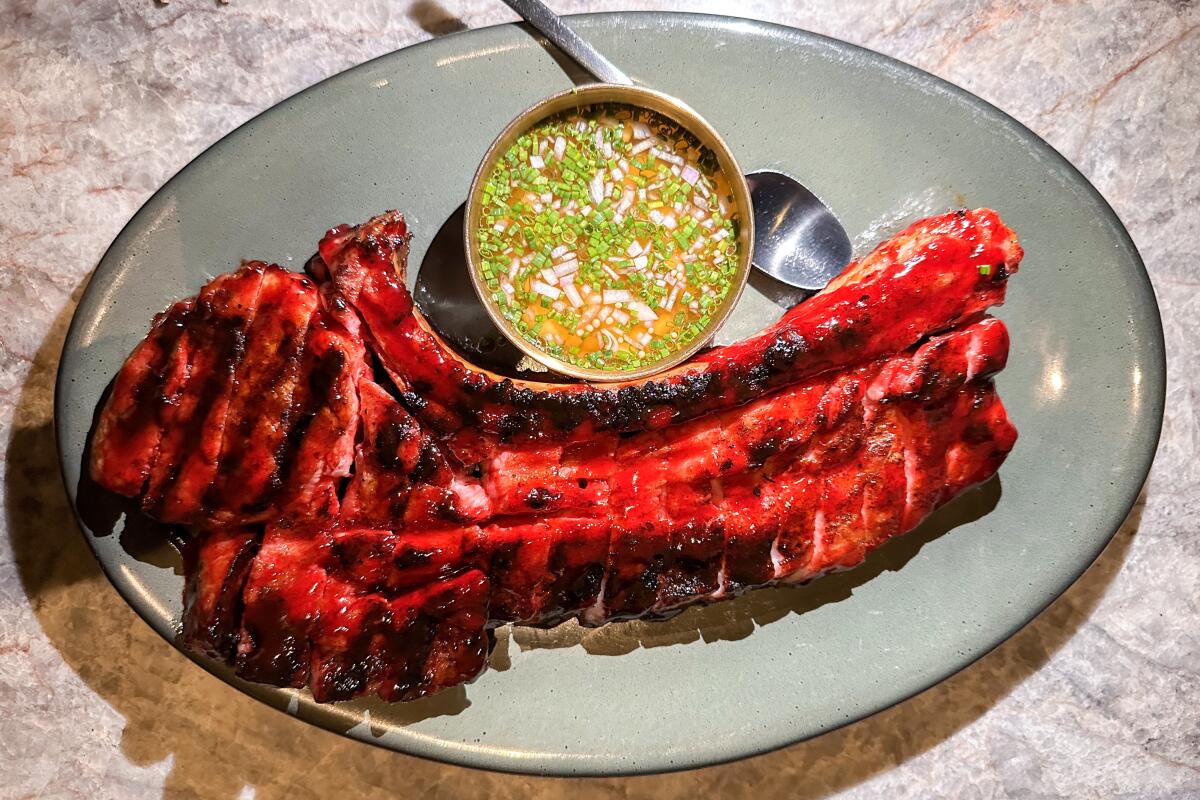 Pork tomahawk tocino at Animae in San Diego.