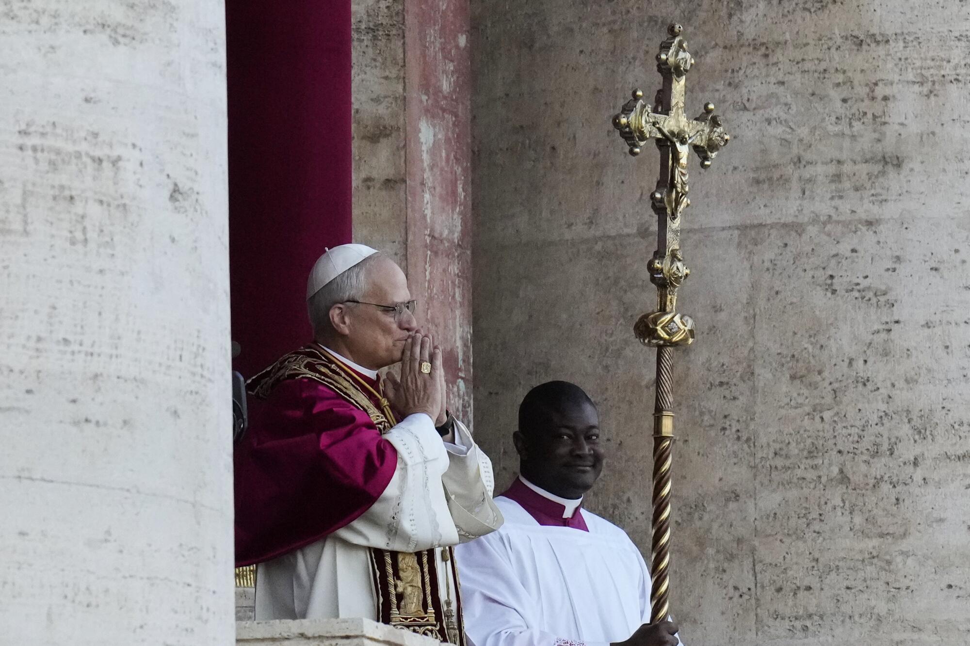 Pope Leo XIV with his hands together.