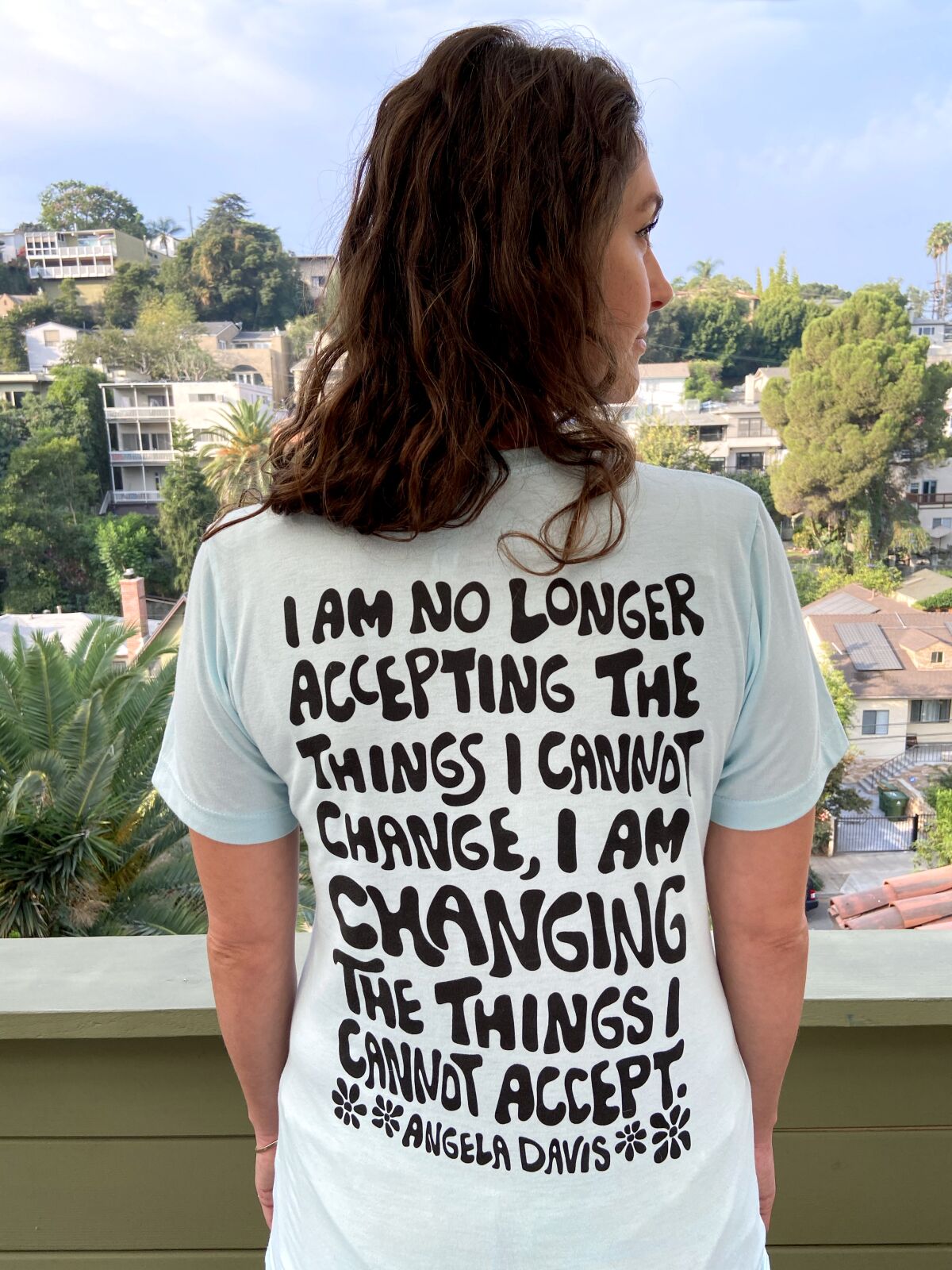 Artist Laurie Berger in her T-shirt from Power to the Ballot.