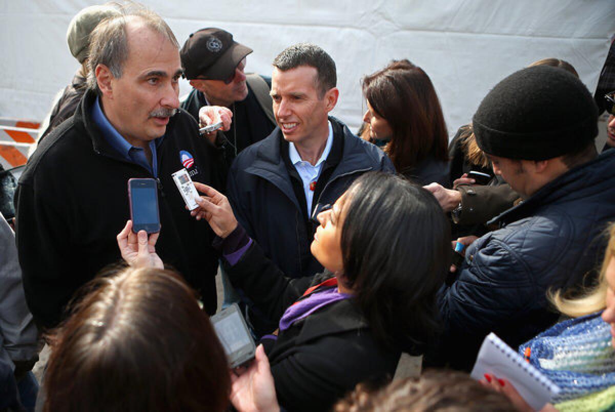 Obama campaign chief strategist David Axelrod, left, and Senior Advisor to the President David Plouffe talk with reporters during the last day of campaigning.