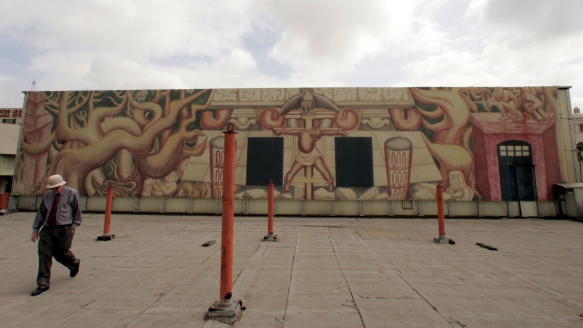 A rendering of David Alfaro Siqueiros' mural covers the actual mural in 2006, as the city prepared to do needed conservation work to bring it back to life.
