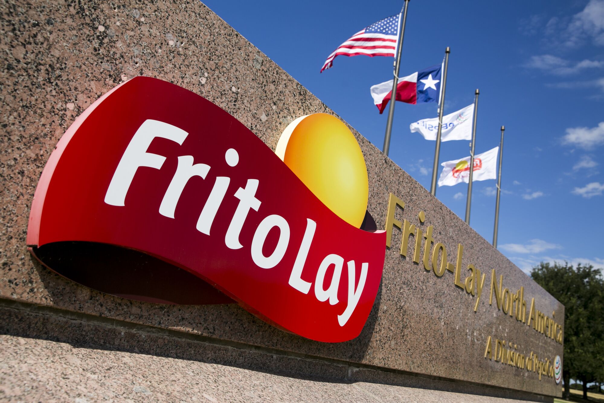 The red and yellow Frito-Lay logo on a sign that says Frito-Lay North America, a division of Pepsi Co