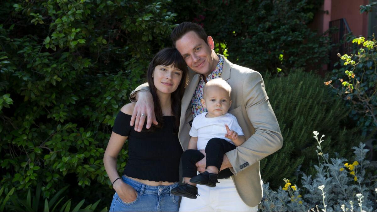 L.A. county singer Sam Outlaw, shown with his wife, Andie, and son, Leo, 1, at their home in Glendale. Family life helped inspire his song "Dry in the Sun," which has become his latest video,