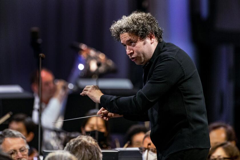 LOS ANGELES, CA - AUGUST 12, 2021: Conductor Gustavo Dudamel conducts the LA Philharmonic at Hollywood Bowl on August 12, 2021 in Los Angeles, California.(Gina Ferazzi / Los Angeles Times)