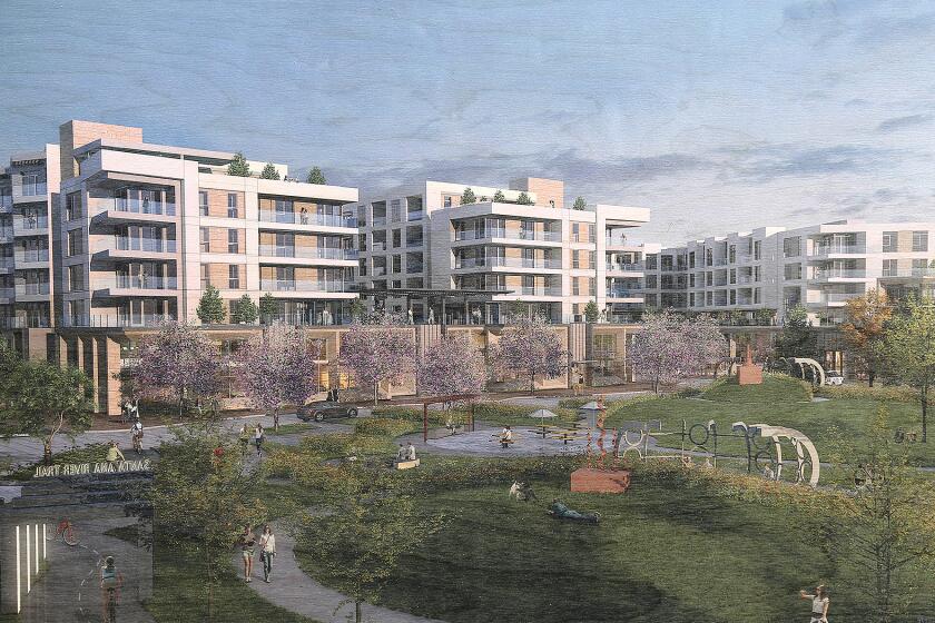 A rendering of One Metro West, a 1,057-unit residential development by Rose Equities on display at the neighborhood block party hosted by the developers at the OC Mix in Costa Mesa on Friday.