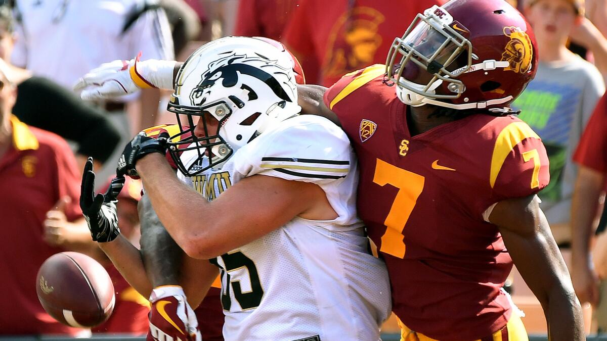 USC defensive back Marvell Tell III breaks up a pass intended for Western Michigan tight end Donnie Ernsberger during the second quarter Saturday.