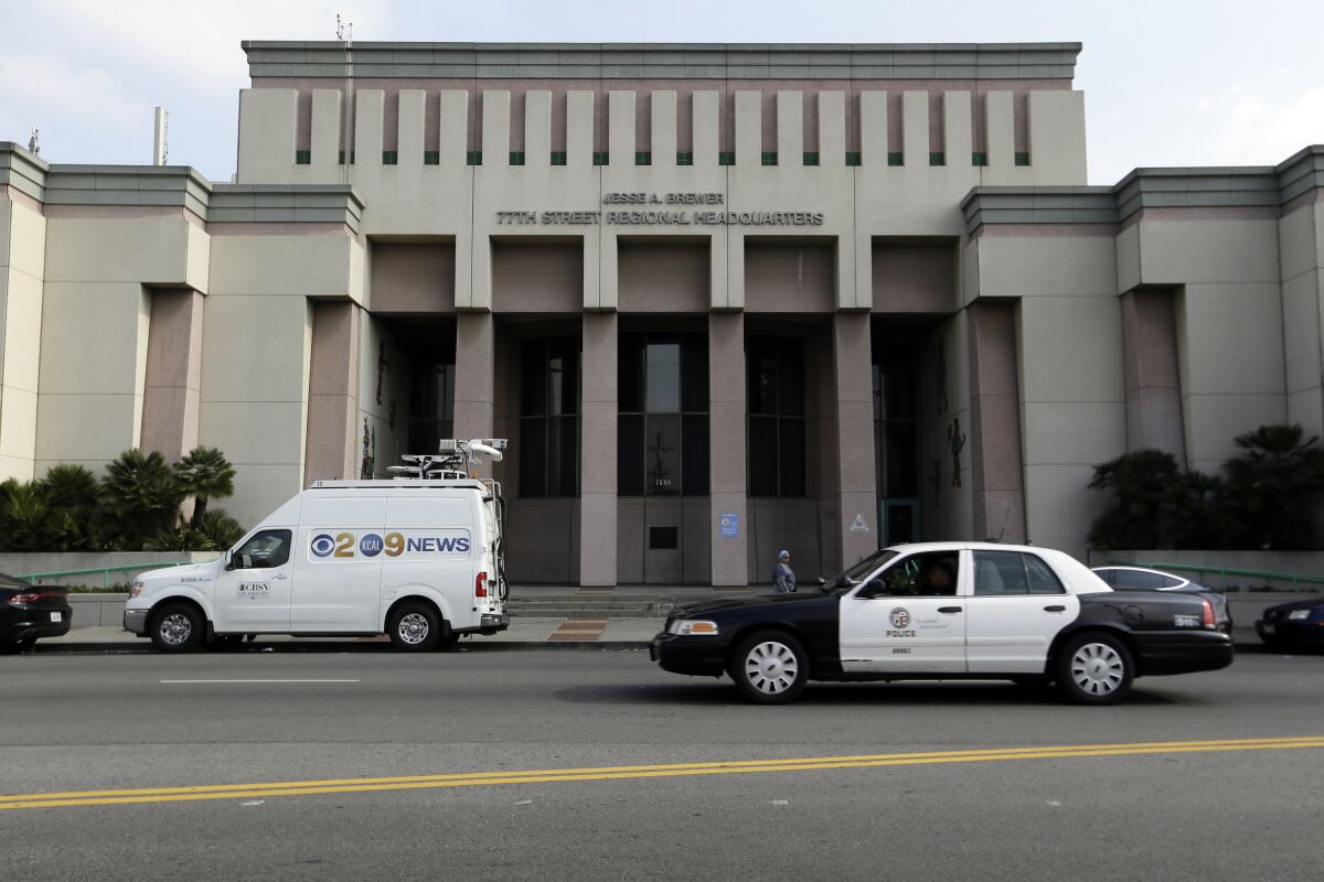 The 77th Street Police station is seen south of downtown in Los Angeles, Tuesday, Jan. 14, 2020. A woman died in custody Tuesday morning at the Los Angeles police station, authorities said. It was not immediately clear why the woman whose name was not released had been arrested or how long she had been in custody at the police station. (AP Photo/Damian Dovarganes)