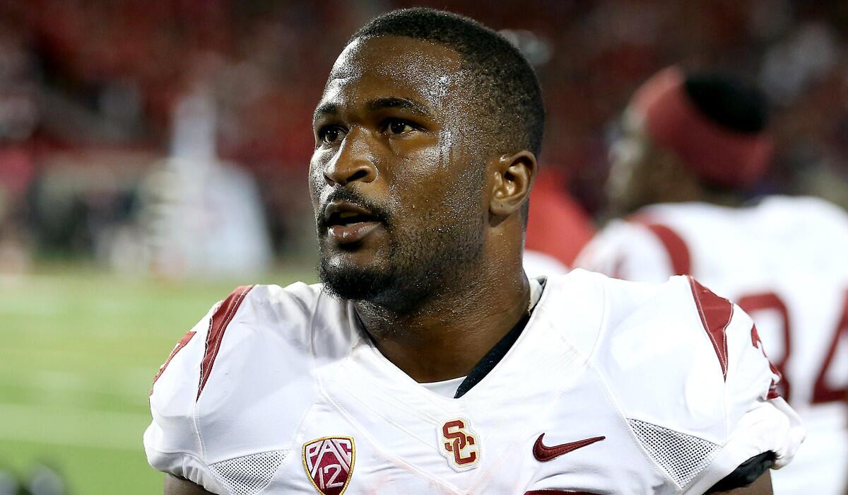 Trojans running back Javorius "Buck" Allen, who had 205 yards in 26 carries, catches his breath on the sideline during a 28-26 victory over Arizona.