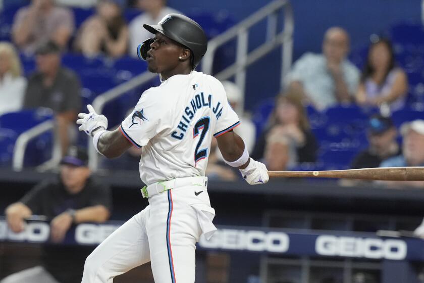 Miami Marlins' Jazz Chisholm Jr. (2) hits a single to left field during the first inning of a baseball game against the Colorado Rockies, Thursday, May 2, 2024, in Miami. Luis Arraez scored on Chisholm's hit. (AP Photo/Marta Lavandier)