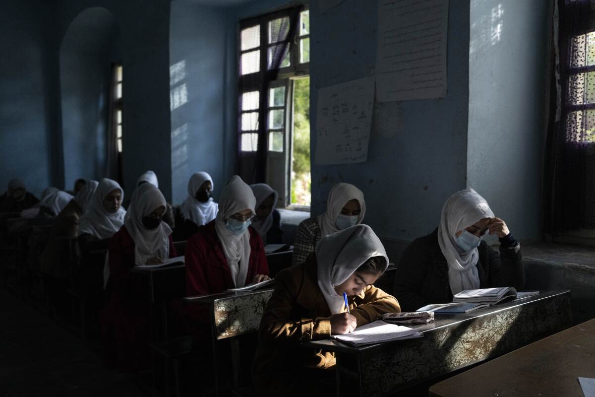 Afghan girls at their desks in school