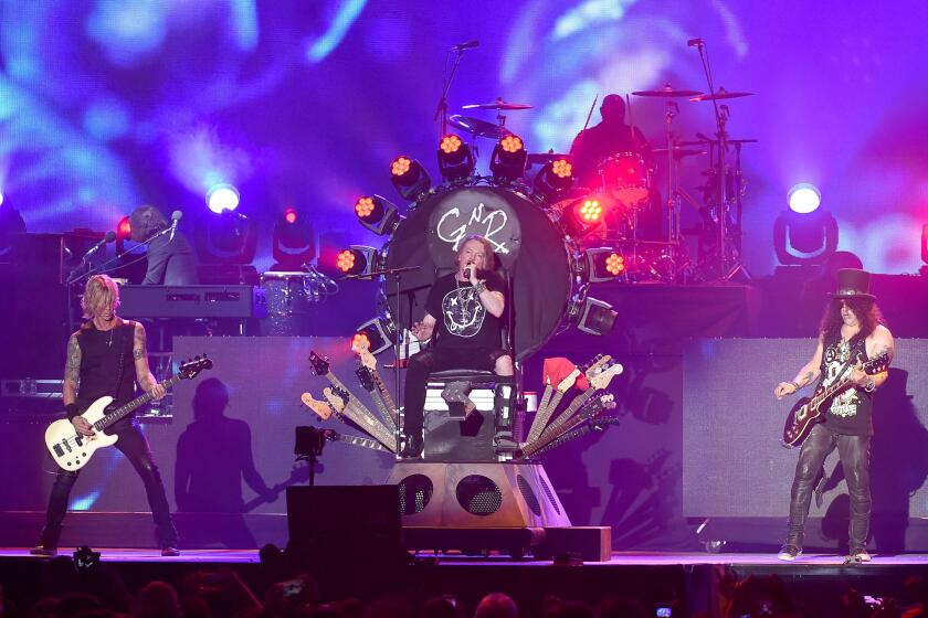 Duff McKagan, Axl Rose and Slash of Guns N' Roses perform onstage at the Coachella Valley Music & Arts Festival last weekend.